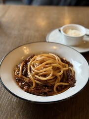 Classic Italian spaghetti with rich meat sauce on restaurant table