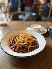 Classic Italian spaghetti with rich meat sauce on restaurant table