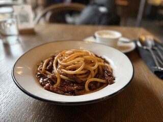 Classic Italian spaghetti with rich meat sauce in cozy restaurant