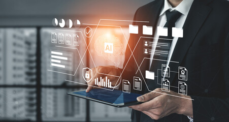Professional businessman interacts with tablet featuring AI technology graphics in a modern office, showcasing data analysis and innovative digital solutions. Gantry