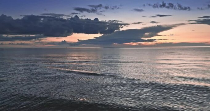 Calm golden sunset over Batlic sea in summer.
