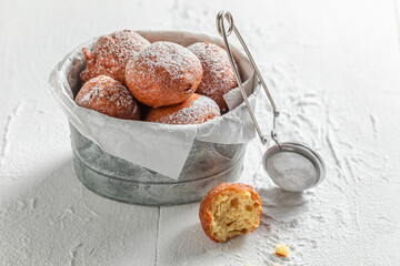 Yummy and hot mini doughnuts ready to eat.