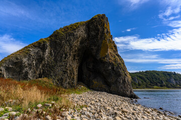 Majestic rock formation towers under Russia's clear blue sky