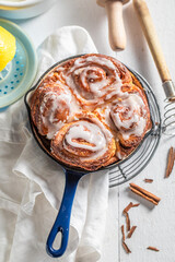 Hot cinnamon buns with cocoa and sugar. Popular Swedish dessert.