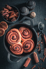 Hot cinnamon rolls with cocoa and sugar. Swedish delicacy.