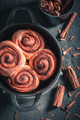 Hot cinnamon buns made of butter. Scandinavian dessert.