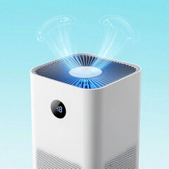 White air purifier emits glowing blue air waves with digital display for fresh indoor air purification