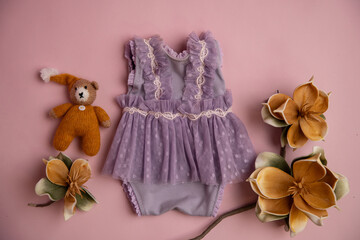 Newborn clothes with toys and flowers in a beautifully folded position for a photo © VideofotKA