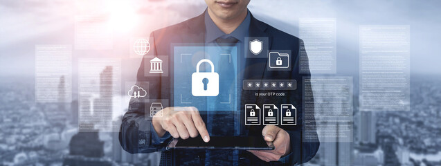 Businessman interacts with a tablet displaying digital lock icons, symbolizing online security and data protection in a modern urban environment. Gantry