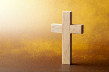 Simple wooden cross on surface against warm golden gradient background creating peaceful atmosphere for spiritual meditation. Generative AI.