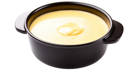 Delicious Creamy Yellow Cheese Sauce or Hollandaise Dressing in a Modern Black Ceramic Dipping Bowl Isolated on a Transparent Background.