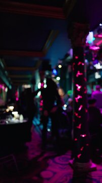 Luminous corridor with stools and shadows, Quiet blue and magenta lights illuminate empty bar