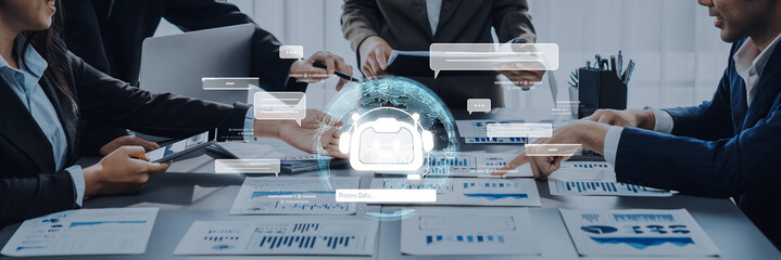 A dynamic business meeting showcasing professionals analyzing data and collaborating on strategies using digital tools while focusing on global connectivity. Trope