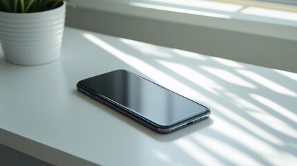 Smartphone lying on a clean white office desk