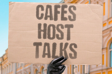"Cafes Host Talks" Coffee shops facilitate conversations. CAFES. CONVERSATION. GATHERING. SOCIAL. DISCUSSION.