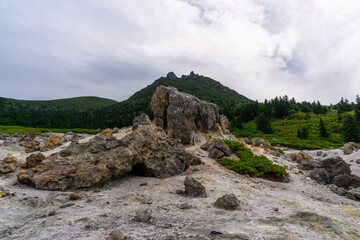 Exploring volcanic landscapes in Russia's remote wilderness during a cloudy day