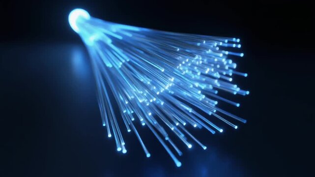 Illuminated optical fibers radiating brilliant blue light, representing the core of global digital communication, high-speed internet, and advanced network technology