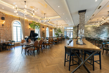 Interior of a modern hotel restaurant with empty seating
