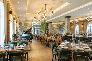 Hotel restaurant interior showing brick walls and vacant tables