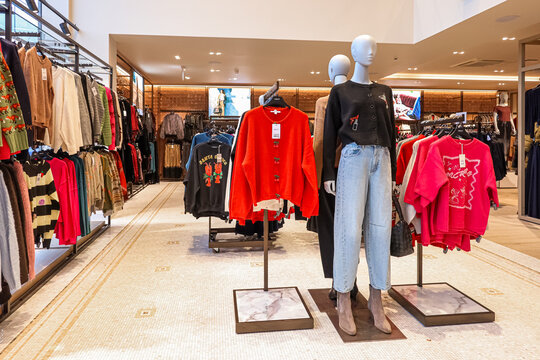Apsley, England, UK December 12, 2025: NEXT clothing store interior with modern clothes and mannequins in shopping environment