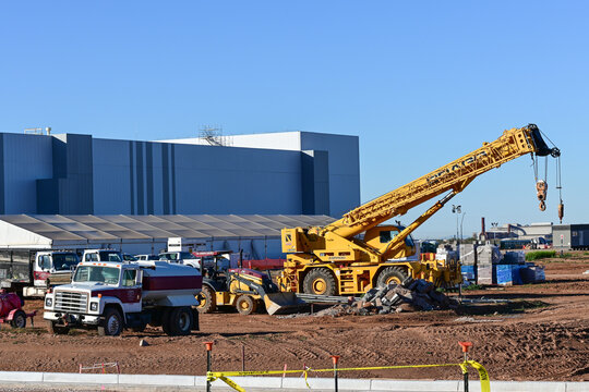 Construction site of the LG Energy Solutions Arizona battery manufacturing plant in Queen Creek, with cranes and heavy equipment, representing storage facility development and large-scale operations