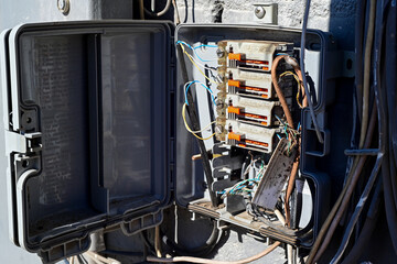 Open phone line junction box with wiring and circuit components, representing telecommunications infrastructure, network distribution, and utility maintenance operations