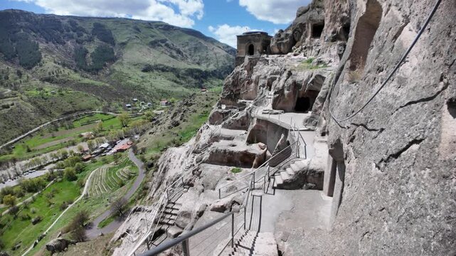 Vardzia, a 12th-century cave monastery in Georgia, stands carved into the Erusheti cliffs, showcasing a remarkable feat of medieval engineering and a significant historical landmark