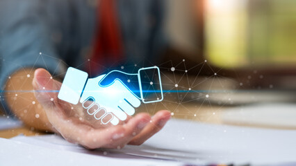 Business partnership concept with digital handshake over open hand represents collaboration, trust, agreement, corporate cooperation, strategic alliance, professional relationship, business networking
