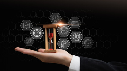 Time management concept with hourglass in business hand and productivity icons represents efficient planning, deadline control, workflow optimization, task prioritization, performance improvement