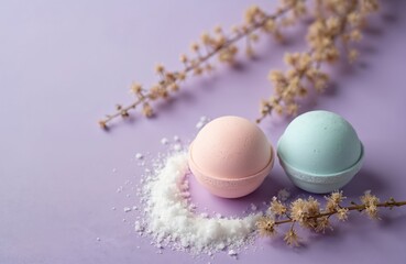 Two colorful bath bombs and sea salt rest near dried flowers on a light purple backdrop. This offers a serene scene for relaxation and self care products. Perfect for spa and beauty promotions.