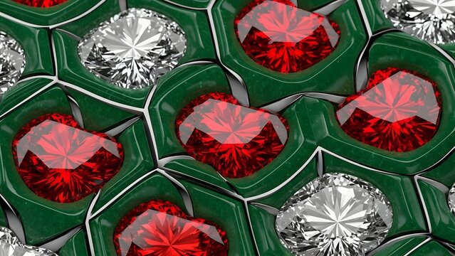 A close-up view of red and white gemstones arranged in green compartments