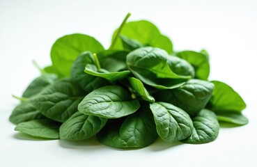 Fototapeta premium Pile of fresh green baby spinach leaves isolated on white background. Healthy leafy vegetable used for salads and cooking. Natural ingredient for dieting. Freshness.