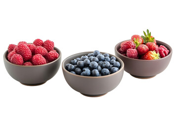 Fresh summer berries in the bowls Blueberries strawberries raspberries shoot from the top isolated on white background