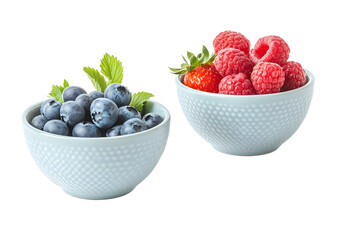 Fresh summer berries in the bowls Blueberries strawberries raspberries shoot from the top isolated on white background