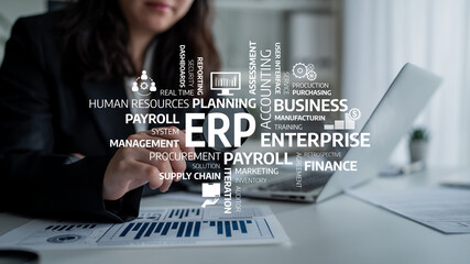 A business woman is engaged in data analysis using ERP software, highlighting payroll and supply chain elements in a modern office environment. Tessel