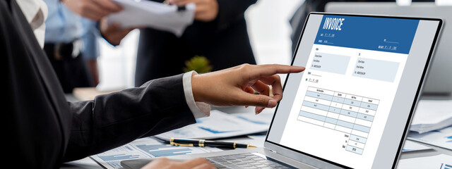 Business intelligence and data analysis concept. Analyst team working on financial data analysis dashboard on laptop screen as marketing indication for effective business strategic planning. Insight