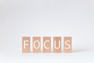 There is wood block with the word FOCUS. It is as an eye-catching image.