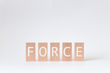 There is wood block with the word FORCE. It is as an eye-catching image.