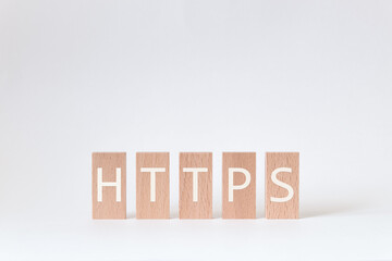 There is wood block with the word HTTPS. It is an abbreviation for Hypertext Transfer Protocol Secure as eye-catching image.