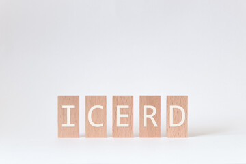There is wood block with the word ICERD. It is an abbreviation for International Convention on the Elimination of All Forms of Racial Discrimination as eye-catching image.