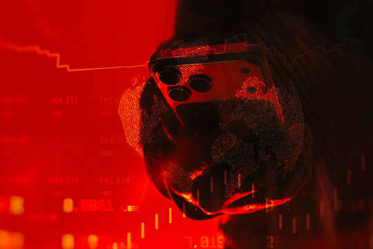 Smartphone held in hand with global data visualization and financial charts on a red background. Concept of digital risk, cybersecurity threat, global finance instability and technology warning. - Powered by Adobe