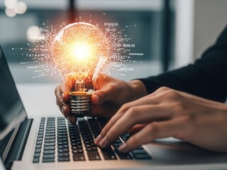 Close-up of hands typing holding glowing light bulb representing artificial intelligence automation and machine learning strategy