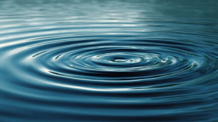 Close-up of serene blue water ripples creating circular patterns.
