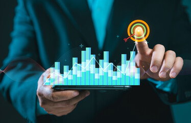 Businessman holding smartphone with virtual AI chatbot interface for customer support. Concept of digital assistant, automated service and future technology.