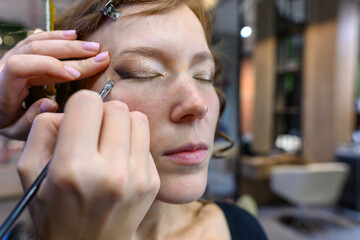 Makeup application in a beauty salon showcasing skill and artistry