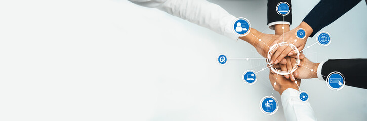 A harmonious display of diverse hands joining together, surrounded by technology icons. This image symbolizes teamwork, partnership, and success in a modern organizational environment. Amity