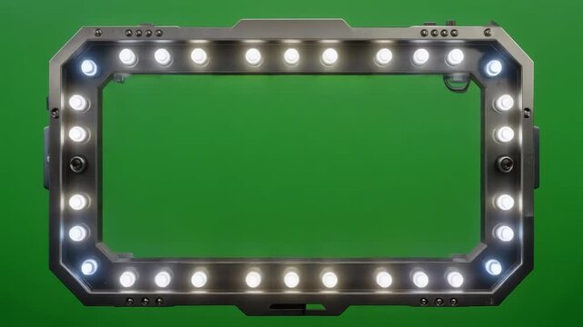 A rectangular frame with lights on a green background, suggesting a stage or production element.
