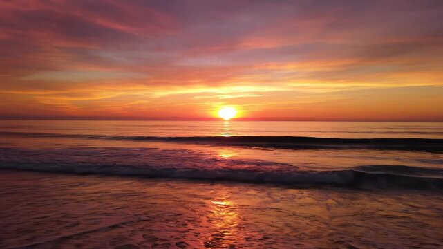 Sunset at the beach with waves