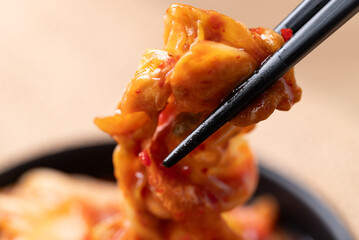 Korean kimchi cabbage eating by chopsticks