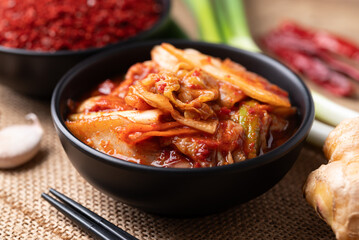 Korean kimchi cabbage in a bowl with ingredients